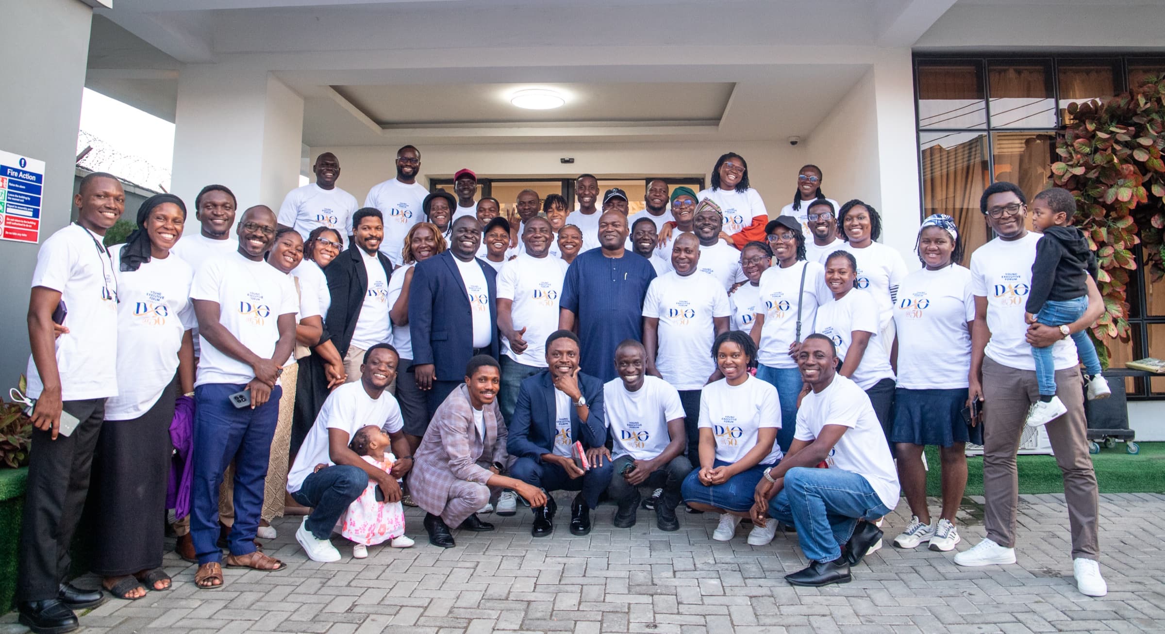 Dr. Ogunsan surrounded by members of the Young Executive Forum wearing DAO @50 shirts